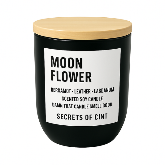 Moon Flower soy candle 8oz with floral musk scent in black vessel, bamboo wooden lid