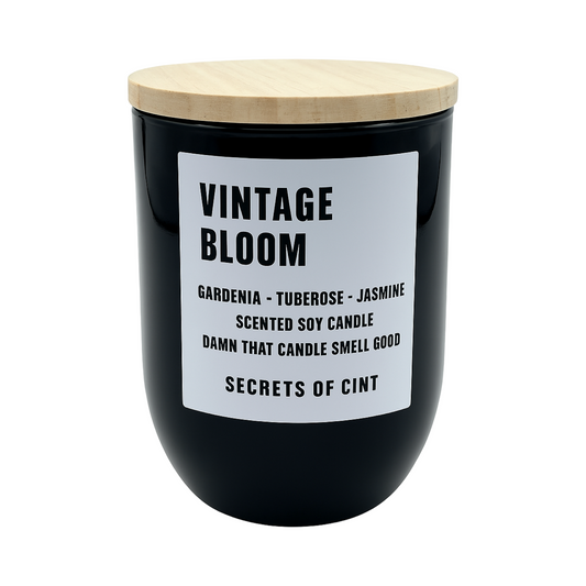 Vintage Bloom soy candle with rose and citrus notes in bamboo-lidded black jar